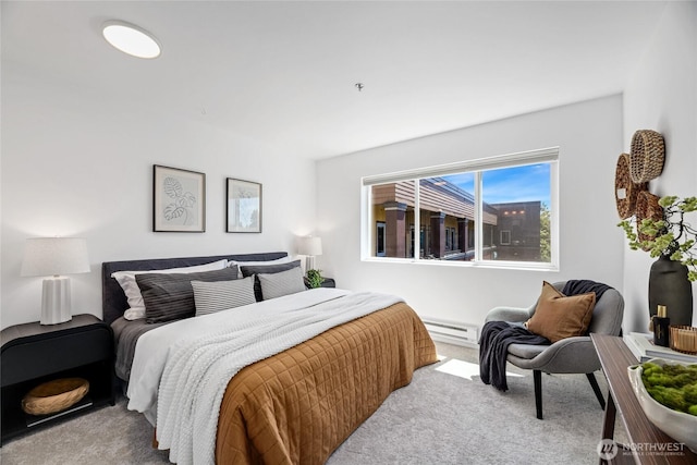 3717 California Ave SW Unit 304, Seattle, WA 98116 - bedroom featuring carpet flooring and a baseboard heating unit