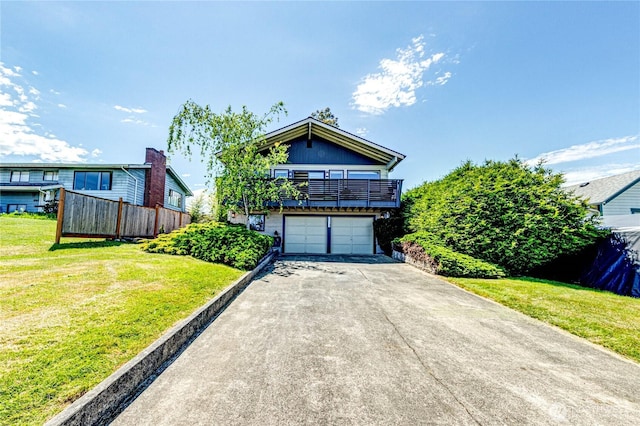 1716 E 4th St, Port Angeles, WA 98362 - view of front facade with a balcony, driveway, a front yard, and an attached garage