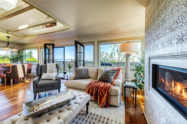 1716 E 4th St, Port Angeles, WA 98362 - living room with light wood-type flooring, a glass covered fireplace, and wallpapered walls