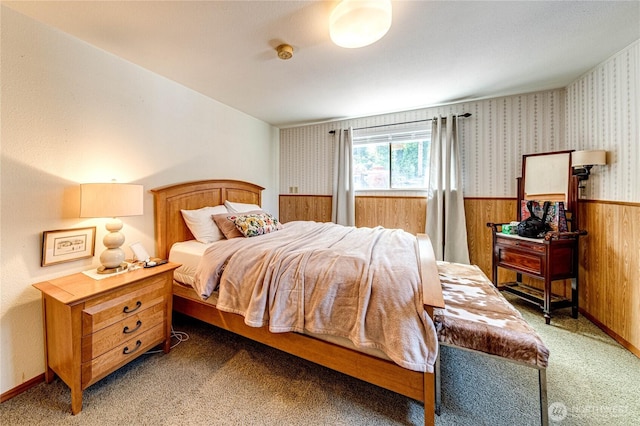 1716 E 4th St, Port Angeles, WA 98362 - carpeted bedroom featuring wainscoting, wooden walls, and wallpapered walls