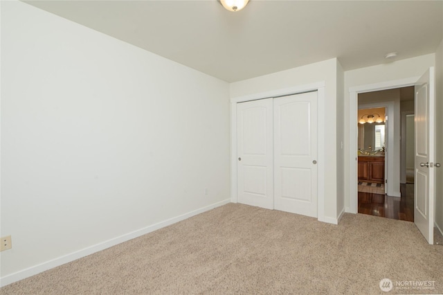 1416 Wilson Ave, Blaine, WA 98230 - unfurnished bedroom featuring carpet floors, a closet, and baseboards
