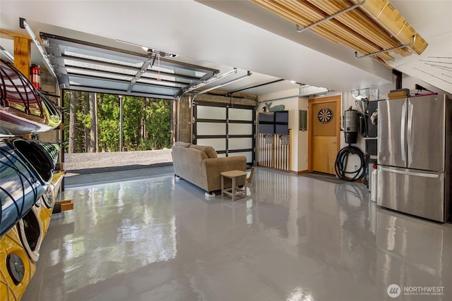 815 Carefree Way, Friday Harbor, WA 98250 - garage with freestanding refrigerator and a central vacuum unit