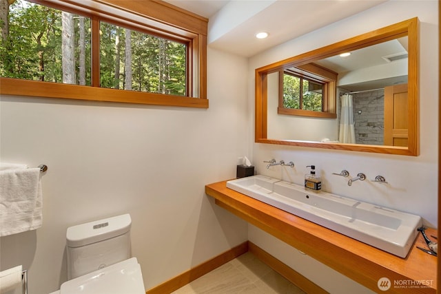815 Carefree Way, Friday Harbor, WA 98250 - full bath featuring healthy amount of natural light, recessed lighting, and curtained shower