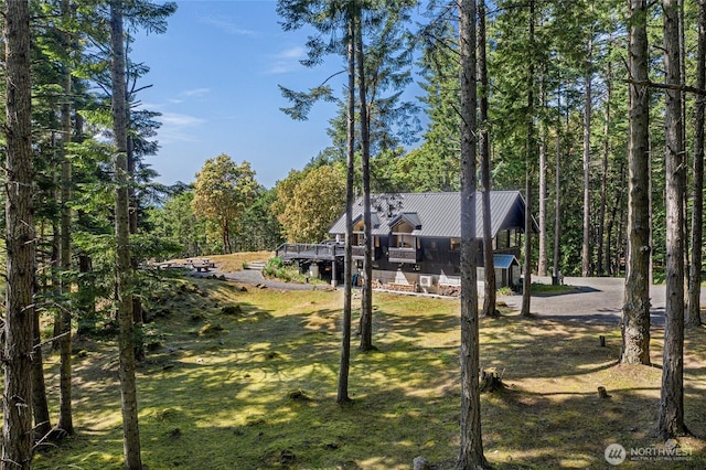 815 Carefree Way, Friday Harbor, WA 98250 - view of front facade with a metal roof and a wooded view