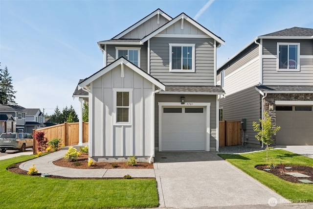 20620 97th Avenue St E Unit 16, Graham, WA 98338 - view of front of property with board and batten siding, a garage, driveway, and a shingled roof