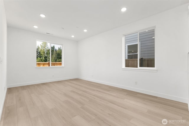 20620 97th Avenue St E Unit 16, Graham, WA 98338 - spare room with light wood-style floors, recessed lighting, and baseboards