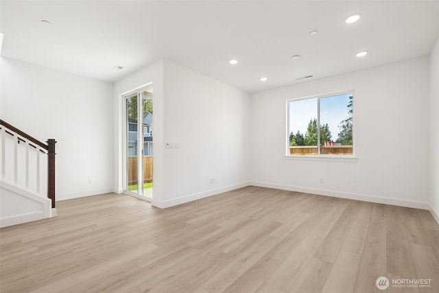 20620 97th Avenue St E Unit 16, Graham, WA 98338 - unfurnished room featuring plenty of natural light, light wood-style floors, recessed lighting, stairs, and baseboards