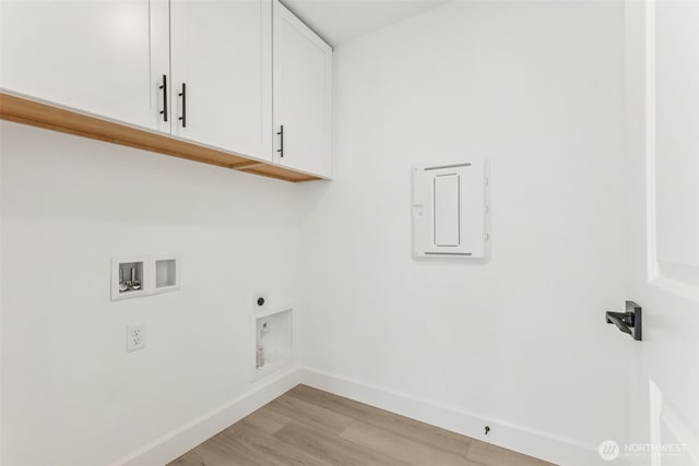 20620 97th Avenue St E Unit 16, Graham, WA 98338 - laundry room featuring cabinet space, washer hookup, light wood finished floors, baseboards, and electric panel