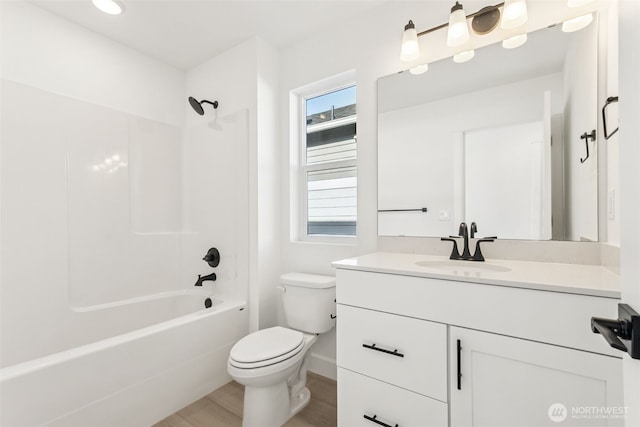 20620 97th Avenue St E Unit 16, Graham, WA 98338 - full bath featuring vanity, toilet, bathing tub / shower combination, wood finished floors, and baseboards