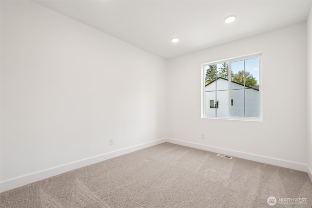 20620 97th Avenue St E Unit 16, Graham, WA 98338 - spare room with baseboards, light colored carpet, and recessed lighting