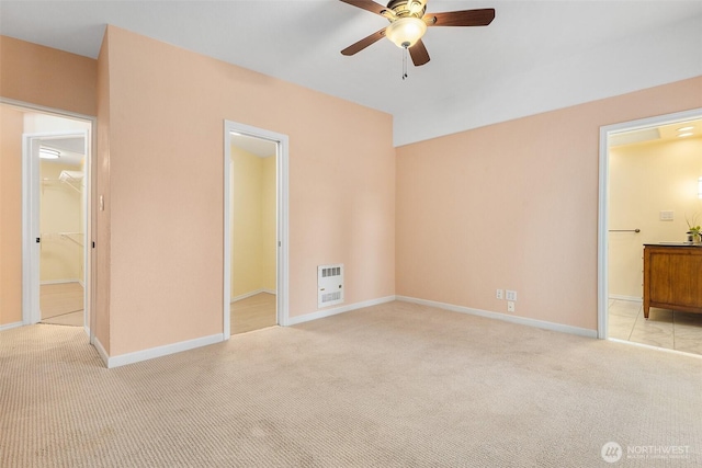 1550 N Narrows Dr, Tacoma, WA 98406 - unfurnished bedroom with light colored carpet, heating unit, baseboards, and connected bathroom
