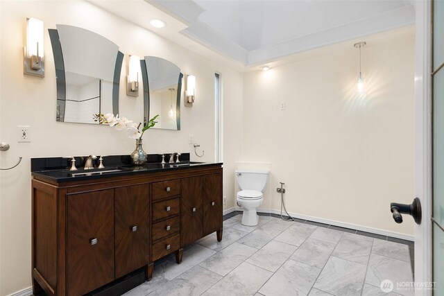 1550 N Narrows Dr, Tacoma, WA 98406 - bathroom featuring double vanity, toilet, and baseboards