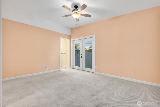 1550 N Narrows Dr, Tacoma, WA 98406 - spare room featuring french doors, ceiling fan, baseboards, and light carpet