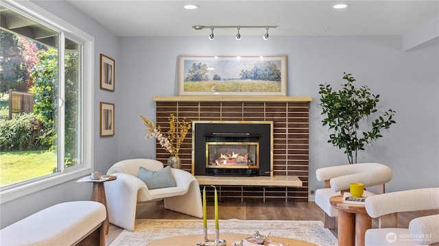 9824 NE 139th St, Kirkland, WA 98034 - sitting room featuring a fireplace, wood finished floors, plenty of natural light, and recessed lighting