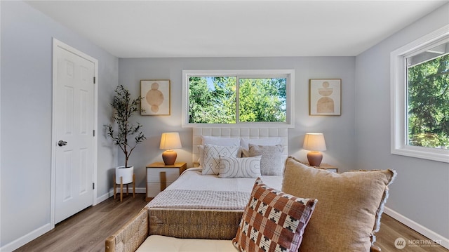 9824 NE 139th St, Kirkland, WA 98034 - bedroom featuring multiple windows, wood finished floors, and baseboards