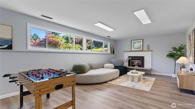 9824 NE 139th St, Kirkland, WA 98034 - recreation room with wood finished floors and a brick fireplace