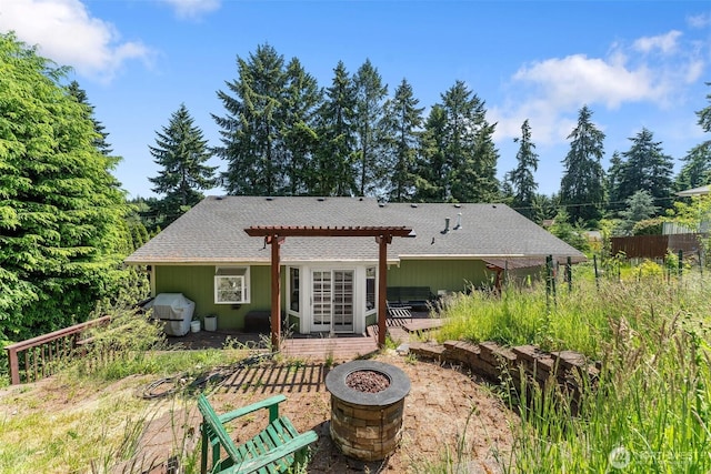 6940 35th St W, University Place, WA 98466 - back of property featuring a fire pit, a pergola, a shingled roof, a deck, and a patio