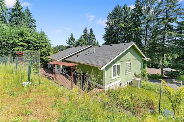 6940 35th St W, University Place, WA 98466 - back of house featuring a shingled roof