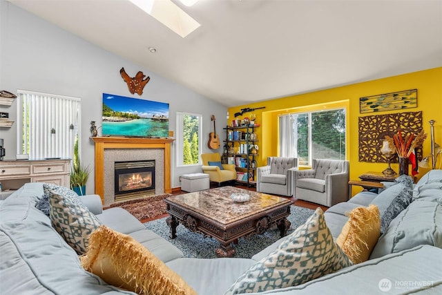 6940 35th St W, University Place, WA 98466 - living area featuring plenty of natural light, wood finished floors, a skylight, a fireplace, and high vaulted ceiling