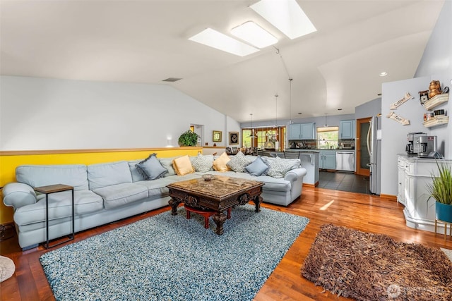 6940 35th St W, University Place, WA 98466 - living room featuring a skylight, lofted ceiling, and wood finished floors