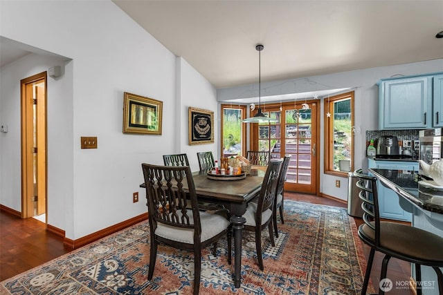 6940 35th St W, University Place, WA 98466 - dining area featuring baseboards, dark wood-style flooring, and lofted ceiling