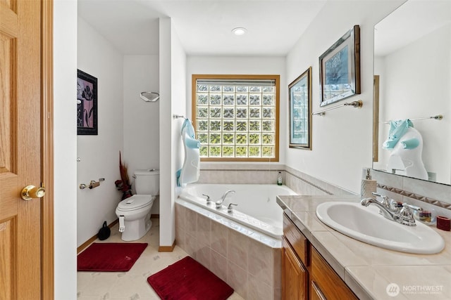 6940 35th St W, University Place, WA 98466 - full bathroom featuring a garden tub, vanity, and toilet