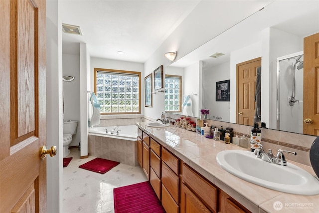 6940 35th St W, University Place, WA 98466 - full bath with toilet, a bath, double vanity, and an enclosed shower