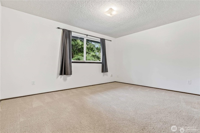 5116 54th St W, University Place, WA 98467 - carpeted spare room with a textured ceiling and baseboards
