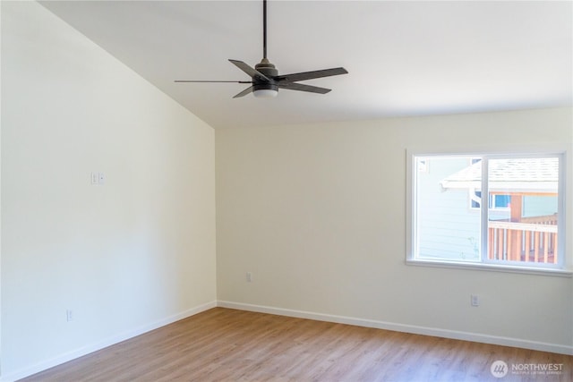 1645 S 272nd St Unit 11, Federal Way, WA 98003 - spare room with light wood-type flooring, ceiling fan, baseboards, and vaulted ceiling