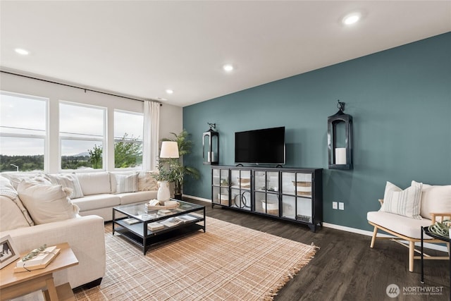 7318 281st Pl NW Unit 42, Stanwood, WA 98292 - living room featuring baseboards, wood finished floors, and recessed lighting