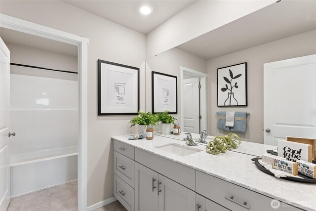 7318 281st Pl NW Unit 42, Stanwood, WA 98292 - bathroom with vanity, shower / tub combination, and baseboards