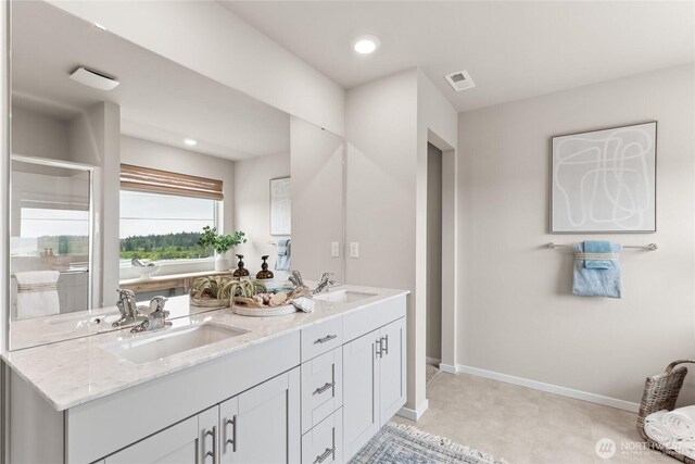 7318 281st Pl NW Unit 42, Stanwood, WA 98292 - full bath featuring double vanity, a bath, baseboards, a stall shower, and recessed lighting