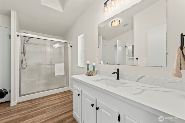 12323 Burchard Dr SW, Port Orchard, WA 98367 - full bath with vanity, a stall shower, wood finished floors, and vaulted ceiling
