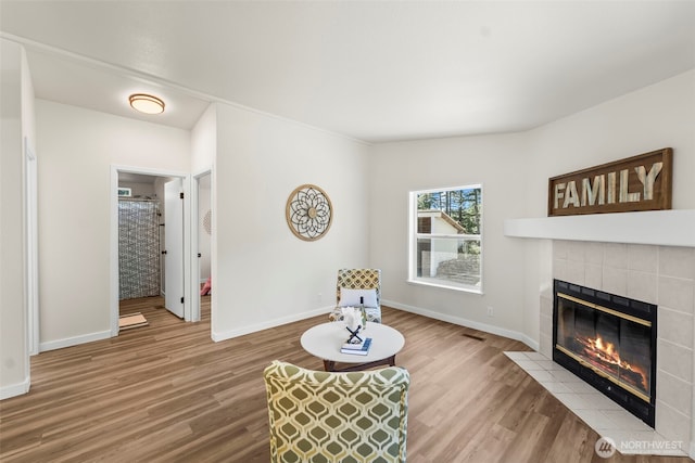12323 Burchard Dr SW, Port Orchard, WA 98367 - living room with a fireplace, wood finished floors, and baseboards