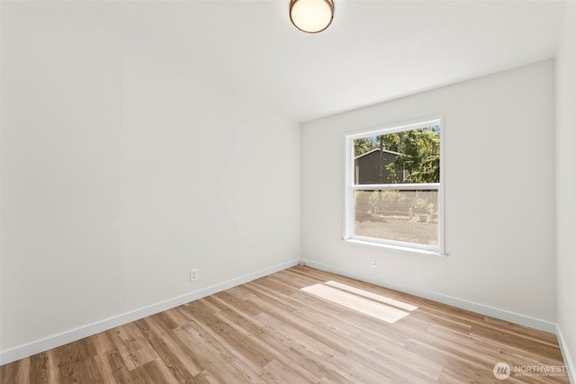 12323 Burchard Dr SW, Port Orchard, WA 98367 - empty room with light wood-type flooring and baseboards