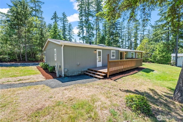 12323 Burchard Dr SW, Port Orchard, WA 98367 - back of house featuring a deck and a yard