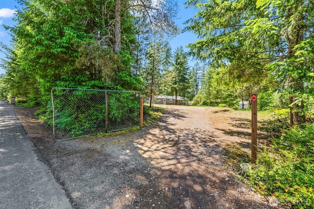 12323 Burchard Dr SW, Port Orchard, WA 98367 - view of road featuring a gate and a gated entry