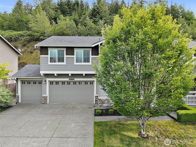 10508 174th Ave E, Bonney Lake, WA 98391 - view of front of home featuring driveway, stone siding, roof with shingles, and board and batten siding