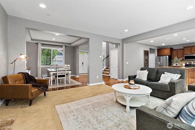 10508 174th Ave E, Bonney Lake, WA 98391 - living area with light carpet, recessed lighting, stairway, and baseboards