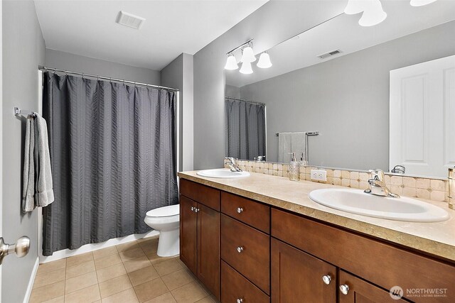 10508 174th Ave E, Bonney Lake, WA 98391 - bathroom with toilet, double vanity, tile patterned flooring, and a shower with curtain