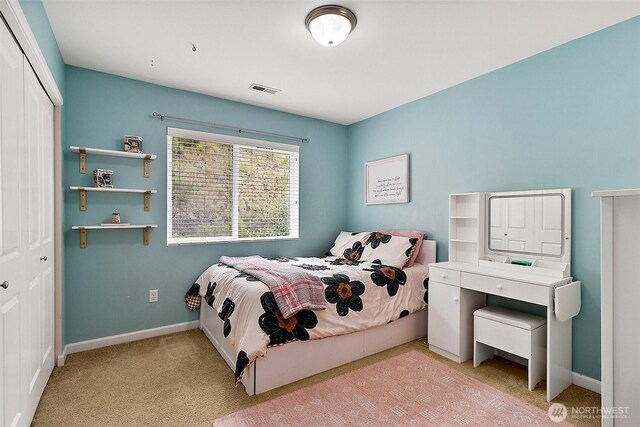 10508 174th Ave E, Bonney Lake, WA 98391 - carpeted bedroom with a closet and baseboards