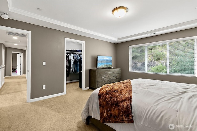 10508 174th Ave E, Bonney Lake, WA 98391 - bedroom with light carpet, baseboards, a spacious closet, a tray ceiling, and crown molding