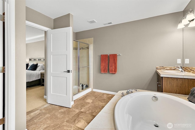 10508 174th Ave E, Bonney Lake, WA 98391 - ensuite bathroom featuring vanity, a stall shower, a bath, and baseboards