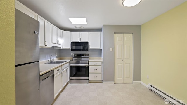 14600 SE 176th St Unit V1, Renton, WA 98058 - kitchen with appliances with stainless steel finishes, a sink, baseboard heating, a skylight, and white cabinets