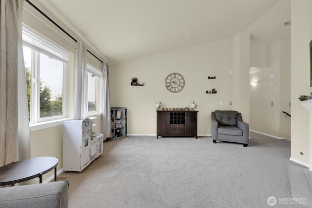 9505 S 214th Pl, Kent, WA 98031 - living area featuring lofted ceiling, carpet floors, and baseboards
