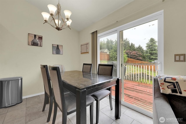 9505 S 214th Pl, Kent, WA 98031 - dining space with a chandelier, lofted ceiling, light tile patterned floors, and baseboards