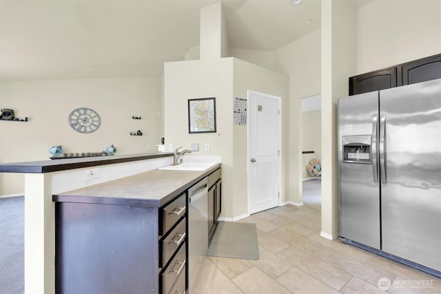 9505 S 214th Pl, Kent, WA 98031 - kitchen featuring appliances with stainless steel finishes, a peninsula, a sink, and baseboards