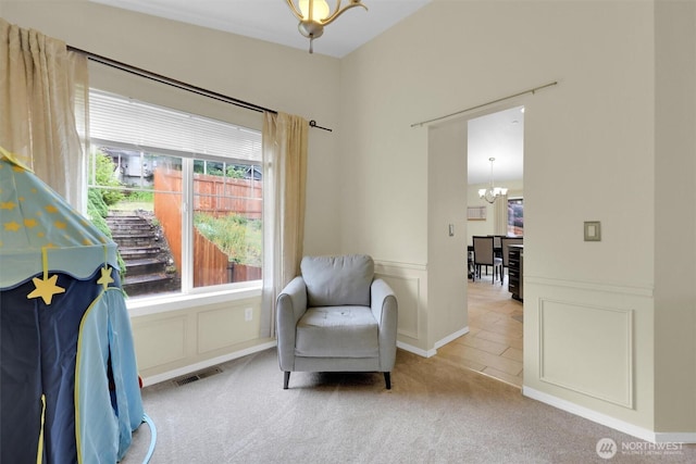 9505 S 214th Pl, Kent, WA 98031 - sitting room featuring a chandelier, carpet floors, and a decorative wall