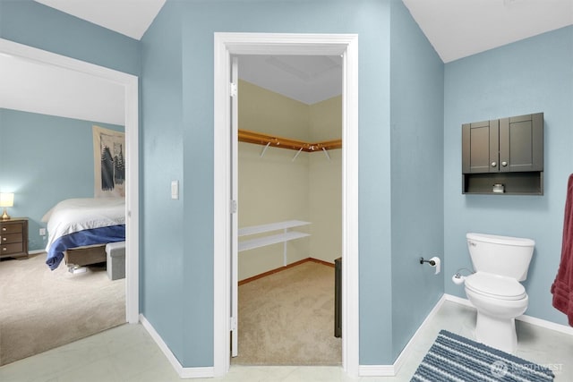 9505 S 214th Pl, Kent, WA 98031 - ensuite bathroom featuring toilet, baseboards, and a spacious closet