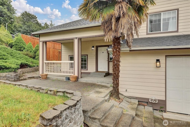 9505 S 214th Pl, Kent, WA 98031 - entrance to property featuring covered porch, a shingled roof, and a garage